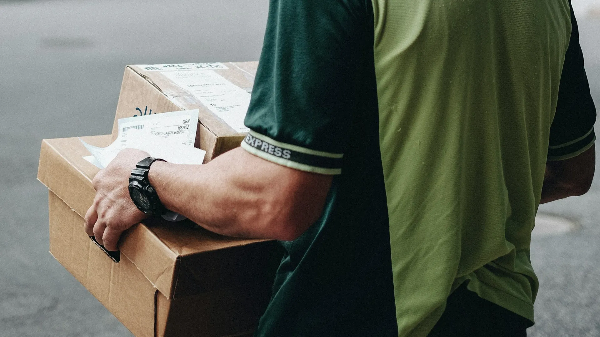 Brisbane delivery driver holding packages